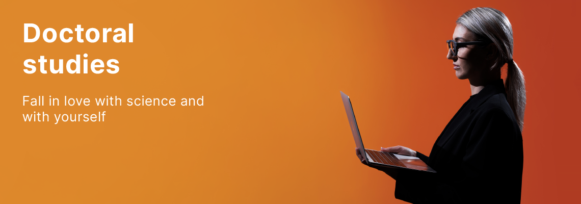 Doctoral studies at KTU – fall in love with science and with yourself. A young KTU PhD student with glasses, holding a laptop and working on it, against a vibrant orange background.